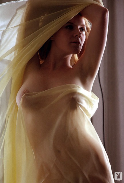 Lusty blonde playgirl Melba shows off her curves